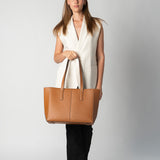 Model holding camel daely tote